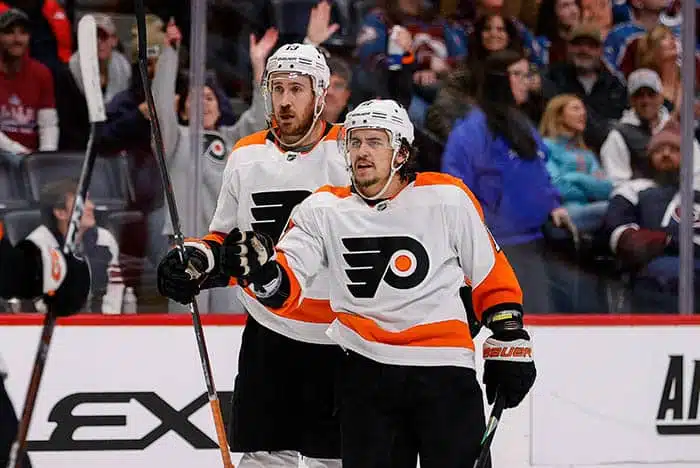 Philadelphia Flyers right wing Travis Konecny (11) celebrates his goal ahead of center Kevin Hayes (13) in the third period against the Colorado Avalanche at Ball Arena.