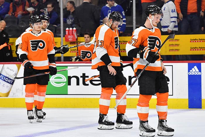 Philadelphia Flyers right wing Owen Tippett (74), center Kevin Hayes (13) and right wing Wade Allison (57) skate off the ice after loss to Toronto Maple Leafs at Wells Fargo Center.