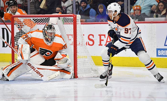 Edmonton Oilers center Connor McDavid (97) looks to make a play against Philadelphia Flyers goaltender Carter Hart (79) during the third period at Wells Fargo Center.