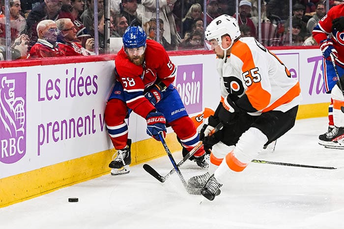 Montreal Canadiens defenseman David Savard (58) defends the puck against Philadelphia Flyers defenseman Rasmus Ristolainen (55) during the second period at Bell Centre. 