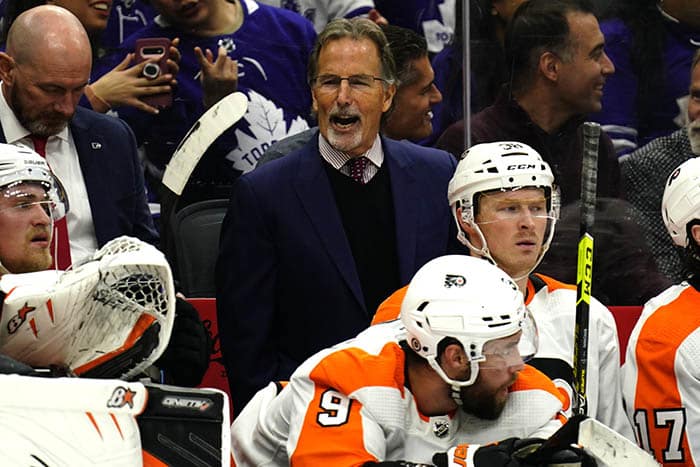 Philadelphia Flyers head coach John Tortorella talks to his team during the third period against the Toronto Maple Leafs at Scotiabank Arena.