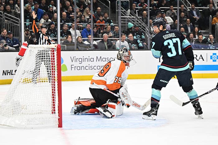 Seattle Kraken center Yanni Gourde (37) scores a goal past Philadelphia Flyers goaltender Carter Hart (79) during the first period at Climate Pledge Arena.