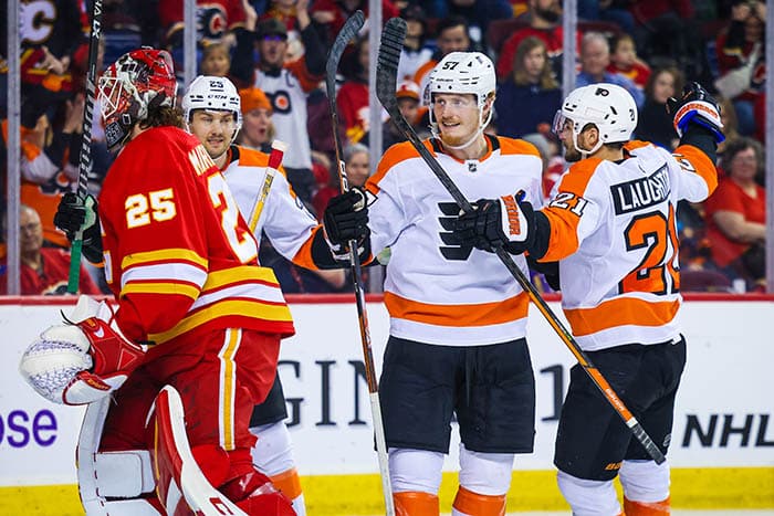 Philadelphia Flyers right wing Wade Allison (57) celebrates his goal with teammates against the Calgary Flames during the third period at Scotiabank Saddledome.