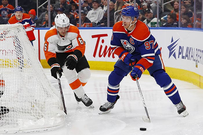 Edmonton Oilers forward Connor McDavid (97) passes in front of Philadelphia Flyers defensemen Travis Sanheim (6) during the third period at Rogers Place.