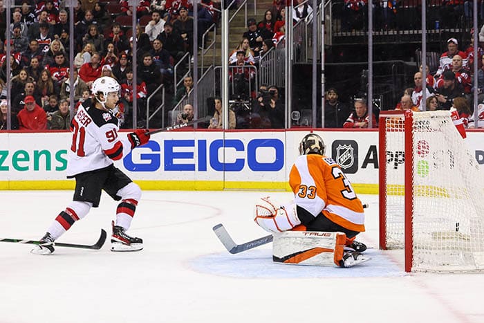 New Jersey Devils center Dawson Mercer (91) scores a goal on Philadelphia Flyers goaltender Samuel Ersson (33) during the second period at Prudential Center.