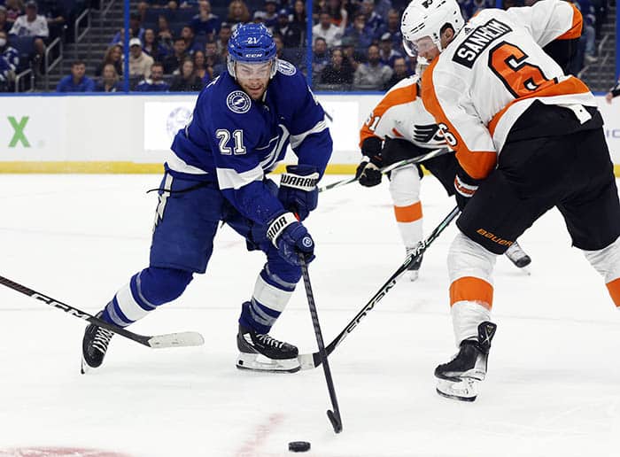 Tampa Bay Lightning center Brayden Point (21) skates with the puck as Philadelphia Flyers defenseman Travis Sanheim (6) defends during the third period at Amalie Arena. 