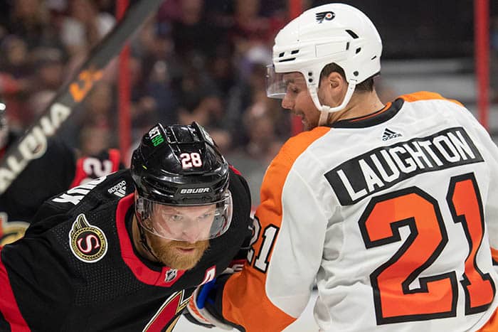 Ottawa Senators right wing Claude Giroux (28) faces off against Philadelphia Flyers center Scott Laughton (21) in the second period at the Canadian Tire Centre.