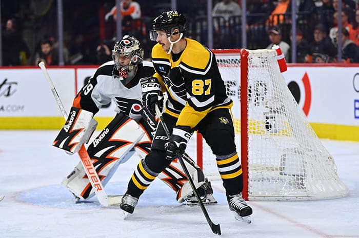 Pittsburgh Penguins center Sidney Crosby (87) stands in front of Philadelphia Flyers goalie Carter Hart (79) in the second period at Wells Fargo Center.
