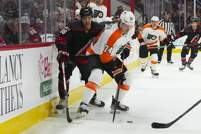 Philadelphia Flyers right wing Owen Tippett (74) controls the puck against Carolina Hurricanes left wing Teuvo Teravainen (86) during the first period at PNC Arena.