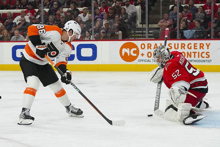 Carolina Hurricanes goaltender Pyotr Kochetkov (52) stops the scoring attempt by Philadelphia Flyers left wing Joel Farabee (86) during the second period at PNC Arena. 