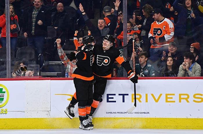 Philadelphia Flyers right wing Owen Tippett (74) celebrates with left wing Scott Laughton (21) after scoring a hat-trick goal against the Buffalo Sabres in the third period at Wells Fargo Center.