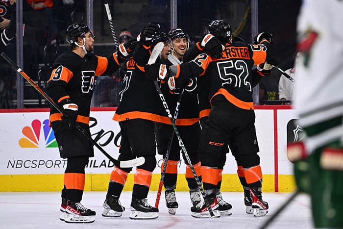 Philadelphia Flyers center Tyson Foerster (52) celebrates with teammates after scoring a goal against the Minnesota Wild in the third period at Wells Fargo Center.