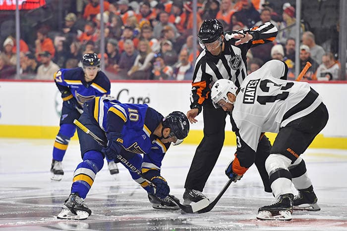 St. Louis Blues center Brayden Schenn (10) and Philadelphia Flyers center Kevin Hayes (13) face-off during the first period at Wells Fargo Center.