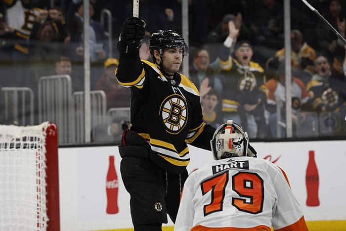 Boston Bruins left wing Jake DeBrusk (74) celebrates his goal on Philadelphia Flyers goaltender Carter Hart (79) during the third period at TD Garden.