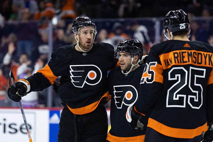 Philadelphia Flyers center Kevin Hayes (13) celebrates with defenseman Tony DeAngelo (77) and left wing James van Riemsdyk (25) after scoring against the Anaheim Ducks during the first period at Wells Fargo Center.