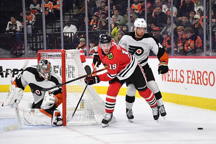 Chicago Blackhawks center Jonathan Toews (19) is defended by Philadelphia Flyers defenseman Cam York (45) during the second period at Wells Fargo Center.