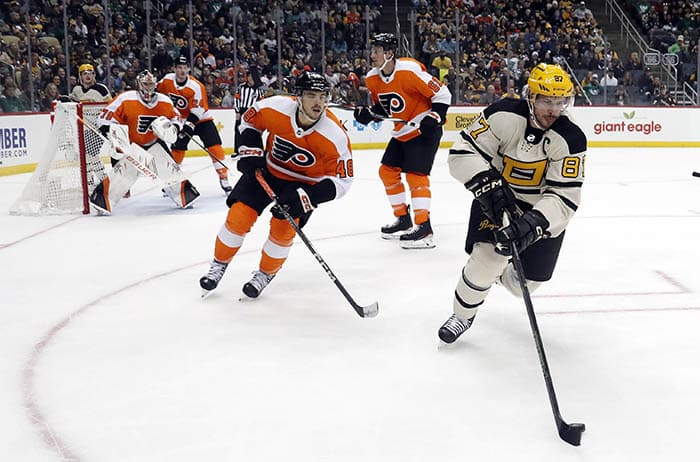 Pittsburgh Penguins center Sidney Crosby (87) moves the puck against the Philadelphia Flyers during the second period at PPG Paints Arena.