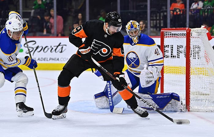 Philadelphia Flyers left wing Noah Cates (49) controls the puck against Buffalo Sabres goalie Craig Anderson (41) in the first period at Wells Fargo Center. 