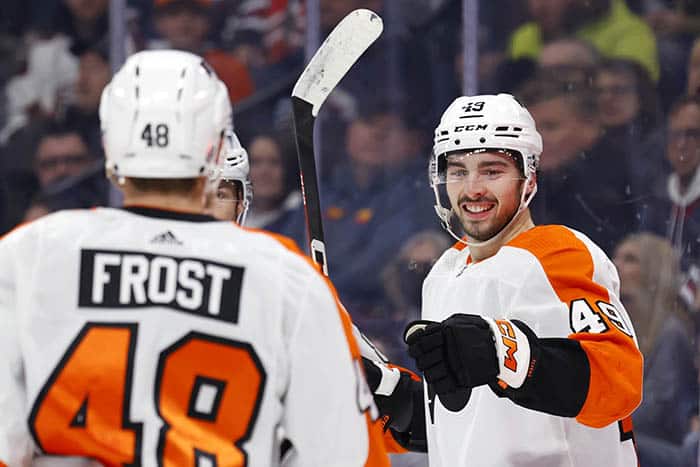 Philadelphia Flyers left wing Noah Cates (49) celebrates with Philadelphia Flyers center Morgan Frost (48) after his first period goal against the Winnipeg Jets at Canada Life Centre.