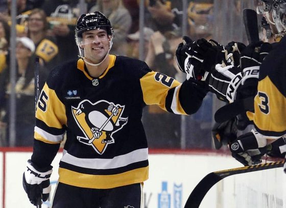 Pittsburgh Penguins center Ryan Poehling (25) celebrates with the bench after scoring a goal against the Washington Capitals during the second period at PPG Paints Arena.