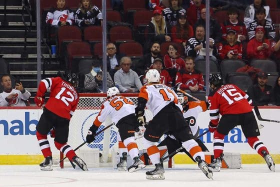 New Jersey Devils right wing Tyce Thompson (12) scores a goal on Philadelphia Flyers goaltender Cal Petersen (40) during the first period at Prudential Center.