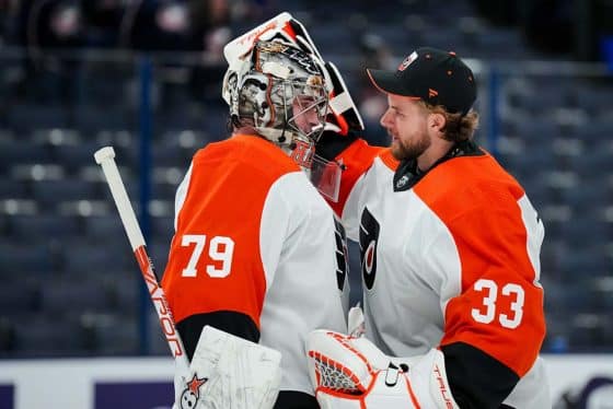 Philadelphia Flyers goaltender Carter Hart (79) and goaltender Samuel Ersson (33) celebrate on the ice after defeating the Columbus Blue Jackets at Nationwide Arena.
