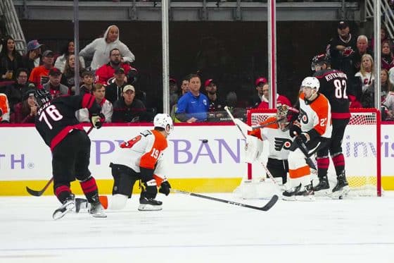 Philadelphia Flyers goaltender Carter Hart (79) left wing Noah Cates (27) and right wing Garnet Hathaway (19) go out to stop eat scoring attempt shot by Carolina Hurricanes defenseman Brady Skjei (76) during the second period at PNC Arena.