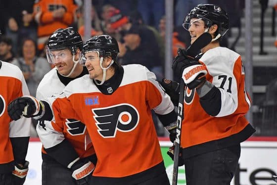 Philadelphia Flyers right wing Travis Konecny (11) celebrates his goal with center Sean Couturier (14) and right wing Tyson Foerster (71) against the Columbus Blue Jackets during the third period at Wells Fargo Center.
