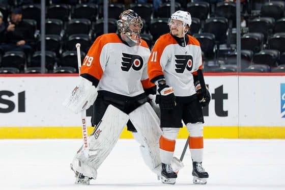 Philadelphia Flyers goaltender Carter Hart (79) and right wing Travis Konecny (11) after the game against the Colorado Avalanche at Ball Arena.