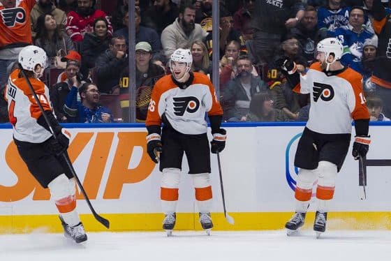 Philadelphia Flyers forward Owen Tippett (74) and defenseman Sean Walker (26) and forward Sean Couturier (14) celebrate Walker’s goal against the Vancouver Canucks in the second period at Rogers Arena.