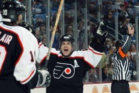 Right wing Mark Recchi #8 of the Philadelphia Flyers celebrates a goal with teammate left wing John LeClair #10 during the game against the Buffalo Sabres at HSBC Arena on March 18, 2003 in Buffalo, New York. The Sabres won 5-2.