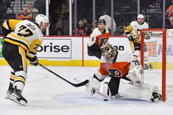 Philadelphia Flyers goaltender Carter Hart (79) makes a save against Pittsburgh Penguins center Jeff Carter (77) during the second period at Wells Fargo Center.