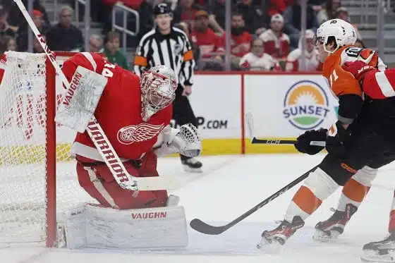 Detroit Red Wings goaltender Alex Lyon (34) makes a save on Philadelphia Flyers right wing Tyson Foerster (71) in the first period at Little Caesars Arena.