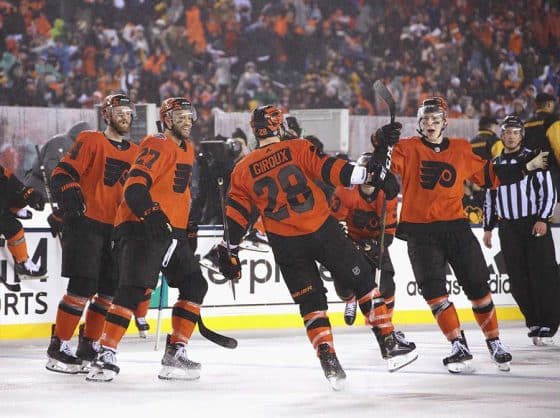 Sean Couturier #14, Justin Bailey #27, Claude Giroux #28 and Robert Hagg #8 of the Philadelphia Flyers celebrate Giroux's overtime goal against the Pittsburgh Penguins during the 2019 Coors Light NHL Stadium Series game at the Lincoln Financial Field on February 23, 2019 in Philadelphia, Pennsylvania. The Flyers defeated the Penguins 4-3 in overtime.