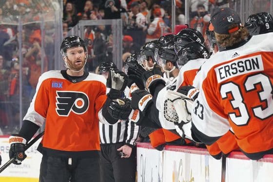 Sean Couturier #14 of the Philadelphia Flyers celebrates with teammates after scoring a goal against the Seattle Kraken in the third period at the Wells Fargo Center on February 10, 2024 in Philadelphia, Pennsylvania. The Flyers defeated the Kraken 3-2.