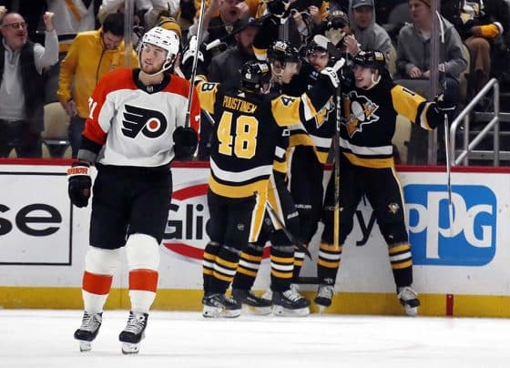 Th Pittsburgh Penguins celebrate a goal by Penguins left wing Drew O'Connor (right) against the Philadelphia Flyers during the third period at PPG Paints Arena. Pittsburgh won 7-6.
