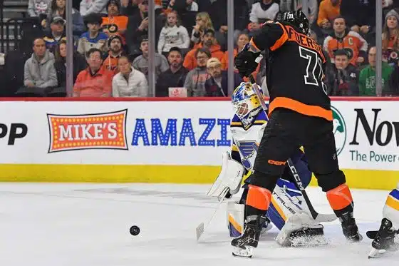 St. Louis Blues goaltender Jordan Binnington (50) makes a save as f72 looks for the rebound during the overtime period at Wells Fargo Center.