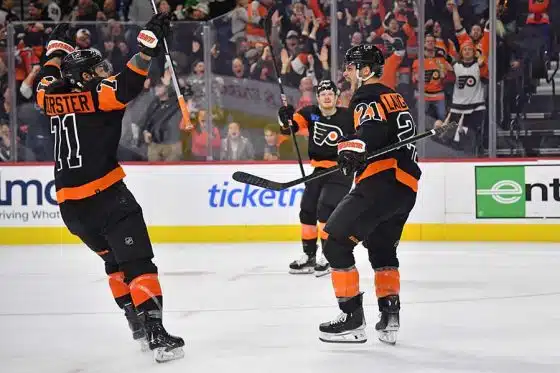 Philadelphia Flyers center Scott Laughton (21) celebrates his goal with right wing Tyson Foerster (71) and right wing Owen Tippett (74) against the Toronto Maple Leafs during the third period at Wells Fargo Center.