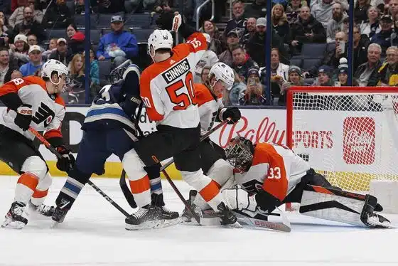 Philadelphia Flyers goalie Samuel Ersson (33) makes a save as Columbus Blue Jackets left wing Johnny Gaudreau (13) looks for a rebound during the first period at Nationwide Arena.