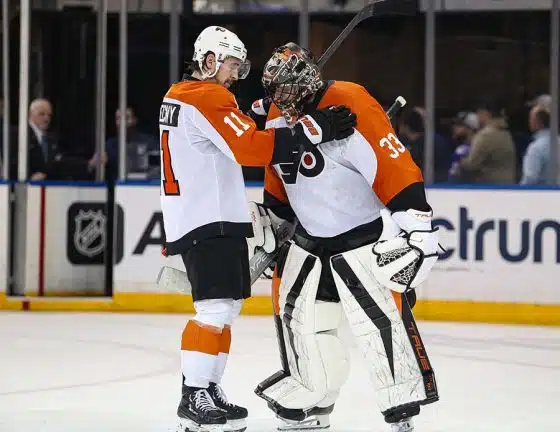 Philadelphia Flyers goalie Samuel Ersson (33) celebrates a 4-1 win against the New York Rangers with center Travis Konecny (11) at Madison Square Garden.