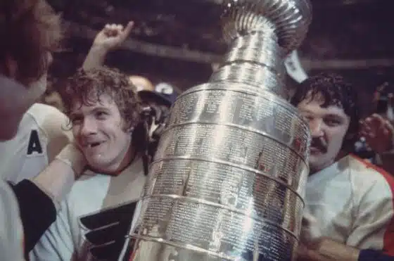 UNITED STATES - MAY 19: Hockey: NHL Finals, Closeup of Philadelphia Flyers Bobby Clarke (16) victorious with Stanley Cup trophy after winning Game 6 and series vs Boston Bruins, Philadelphia, PA 5/19/1974