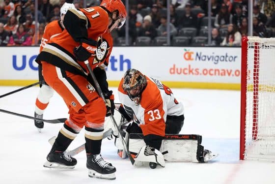 Dec 28, 2024; Anaheim, California, USA; Philadelphia Flyers goaltender Samuel Ersson (33) makes a save against Anaheim Ducks center Leo Carlsson (91) during the second period at Honda Center.