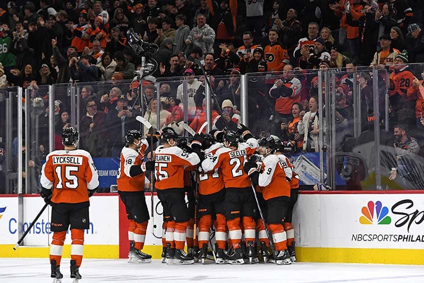 Jan 21, 2025; Philadelphia, Pennsylvania, USA; Philadelphia Flyers celebrate win against the Detroit Red Wings in overtime at Wells Fargo Center.