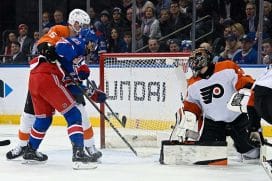 Jan 23, 2025; New York, New York, USA; New York Rangers defenseman Braden Schneider (4) (not pictured) scores a goal past Philadelphia Flyers goaltender Samuel Ersson (33) during the first period at Madison Square Garden.