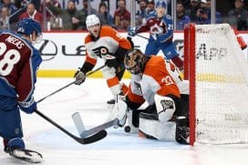 DENVER, COLORADO - FEBRUARY 02: Samuel Ersson #33 of the Philadelphia Flyers makes a save against Martin Necas #88 of the Colorado Avalanche in the second period at Ball Arena on February 02, 2025 in Denver, Colorado.