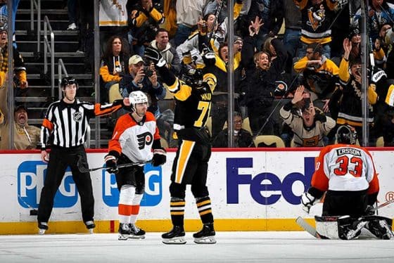 PITTSBURGH, PA - FEBRUARY 27: Evgeni Malkin #71 of the Pittsburgh Penguins celebrates his game winning overtime goal against the Philadelphia Flyers at PPG PAINTS Arena on February 27, 2025 in Pittsburgh, Pennsylvania.
