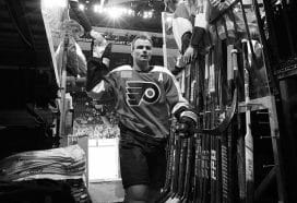 PHILADELPHIA, PENNSYLVANIA - MARCH 12: (EDITOR'S NOTE: This image has been converted to Black and White.) Scott Laughton #21 of the Philadelphia Flyers greeted by the fans following warm-ups against the San Jose Sharks at the Wells Fargo Center on March 12, 2024 in Philadelphia, Pennsylvania.