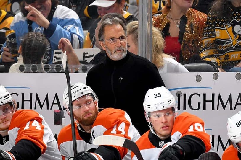 PITTSBURGH, PA - DECEMBER 23: John Tortorella of the Philadelphia Flyers looks on against the Pittsburgh Penguins at PPG PAINTS Arena on December 23, 2024 in Pittsburgh, Pennsylvania.