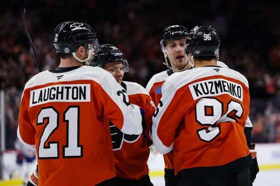 PHILADELPHIA, PENNSYLVANIA - FEBRUARY 22: Andrei Kuzmenko #96 of the Philadelphia Flyers celebrates with Scott Laughton #21, Matvei Michkov #39, and Rasmus Ristolainen #55 after scoring a goal during the second period of the game against the Edmonton Oilers at the Wells Fargo Center on February 22, 2025 in Philadelphia, Pennsylvania.