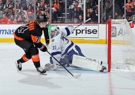 PHILADELPHIA, PENNSYLVANIA - MARCH 13: Owen Tippett #74 of the Philadelphia Flyers scores a goal during the fifth round of the shootout against Jonas Johansson #31 of the Tampa Bay Lightning at the Wells Fargo Center on March 13, 2025 in Philadelphia, Pennsylvania. This goal would be the game-winner as the Flyers defeated the Lightning 4-3.